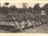 Cpl Leonard W. Hansman, 634th Tank Destoyer Bn., fourth from left on tanks. [Photo courtesy of Brenda Daas, niece of L. W. Hansman]
