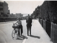 "Sol Thatch and unnamed woman on bike, England (English Channel in background)"  - Photo courtesy of Kelsey and Megan Walsh, granddaughters of James Walsh (Co. A/HQ Co).
