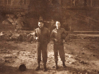 "Walsh (L) and Barnes (2 unknown in background), in front of the University Building in Bonn, Germany"  - Photo courtesy of Kelsey and Megan Walsh, granddaughters of James Walsh (Co. A/HQ Co).