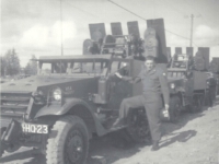 Clifford with his vehicle  Clifford (not further identified) with his vehicle. [Photo courtesy of Brenda Daas, niece of L. W. Hansman]